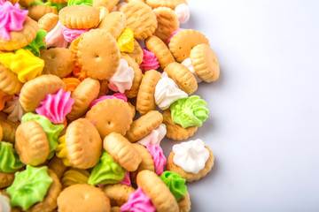 Belly button iced gem biscuits over white background © akulamatiau
