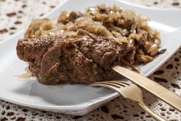 Beef roulade with cabbage.