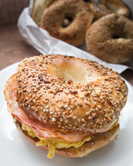 New York style breakfast bagel with scrambled eggs and ham