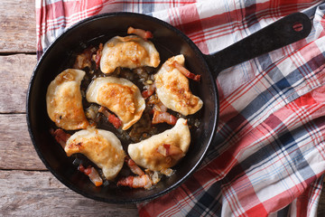 fried dumplings in a pan close-up. horizontal top view