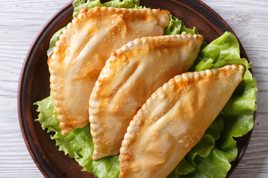 empanadas on a plate close-up. horizontal view from above