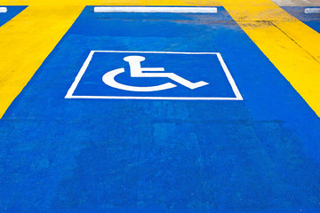 blue road marking for disabled and invalid parking