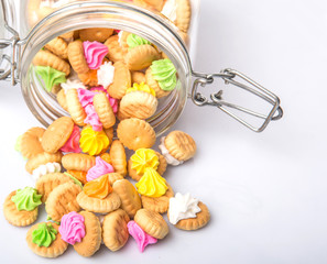 Belly button iced gem biscuits over white background © akulamatiau