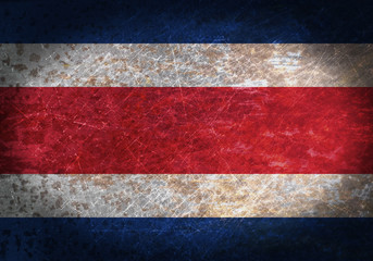 Old rusty metal sign with a flag