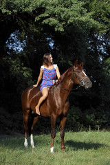 Girl posing on a horse bareback