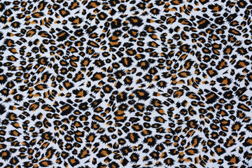The fabric of motifs leopard on background