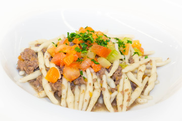 Pasta Strozzapreti with meat sauce and vegetables