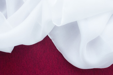 fine silk on marsala red background