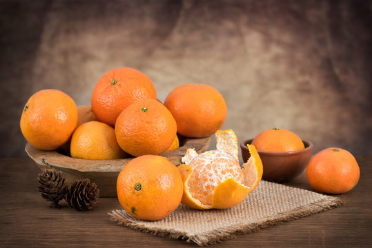 Still life with fresh mandarins in a basket
