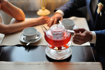 Couple in a cafe drinking tea