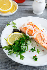 Grilled Salmon with lemon, herbs and onions