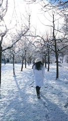 Woman walking in the snow