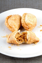 Curry Puffs on white dish