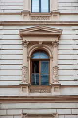 Fototapeta na wymiar old window with elements of modeling