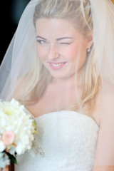 Naklejka premium beautiful blonde bride winking eye