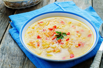 soup with salmon, potatoes and millet