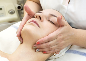 Fototapeta na wymiar massage and facial peels at the salon cosmetics