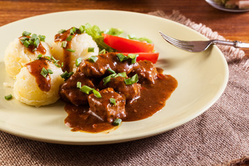 Goulash with boiled potatoes