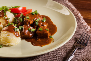 Goulash with boiled potatoes
