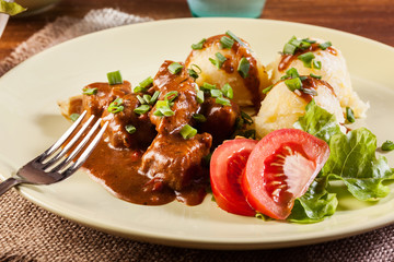 Goulash with boiled potatoes