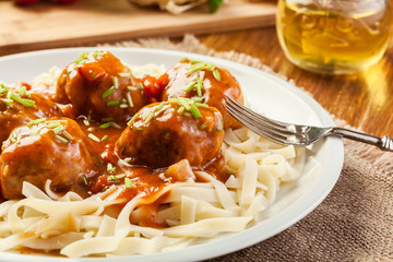 Pasta fettuccine and meatballs with tomato sauce