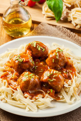Pasta fettuccine and meatballs with tomato sauce