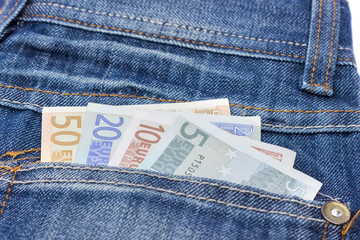 Blue jeans with euro notes in back pocket