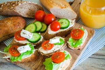Small tasty bites for breakfast on wooden table