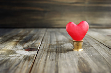 Fototapeta premium Small hearts on a wooden background