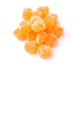 Orange colored sugar jelly candy over white background