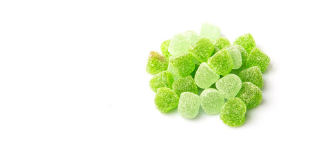 Green colored sugar jelly candy over white background