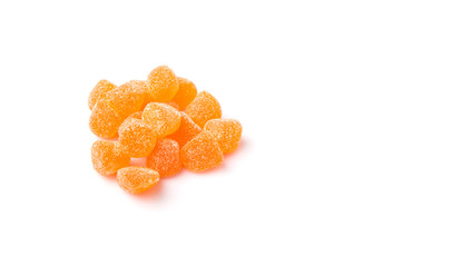 Orange colored sugar jelly candy over white background