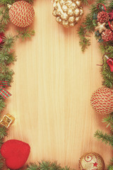 Fototapeta na wymiar Christmas decoration with fir tree and ornamentals on wood boar