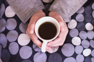 Warming with TEA male hands holding a cup of tea 