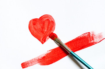 painting red heart shape on white