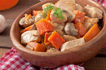 Stew chicken with vegetables and mushrooms in a cream sauce
