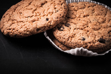 Oat cookies on the old shabby background. tinted. with space for
