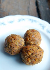 carrot truffles with poppy seeds on a dessert plate