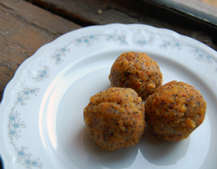 carrot truffles with poppy seeds on a dessert plate