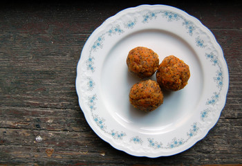 carrot truffles with poppy seeds on a dessert plate