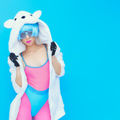 teddy bear girl on a blue background. Crazy winter party. Club d - obrazy, fototapety, plakaty