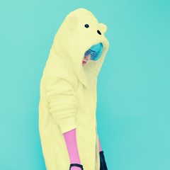 Teddy bear crazy girl in a bright hoodie on a blue background co