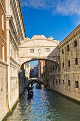 Bridge of sighs with gondolas under the bridge in Venice