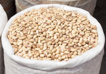 Close up of sack of fresh pistachios.