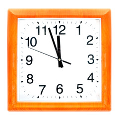 At the eleventh hour on a retro clock with wooden frame.