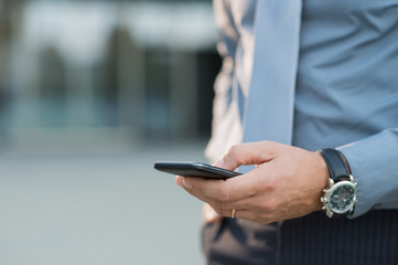 Businessman Holding Smartphone