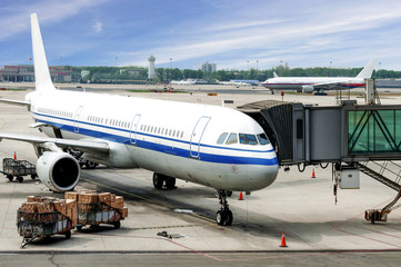 Airplane near the terminal in an airport