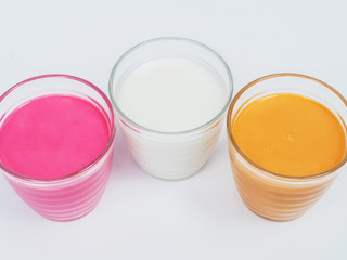 Strawberry milk, white milk and tea milk in glass