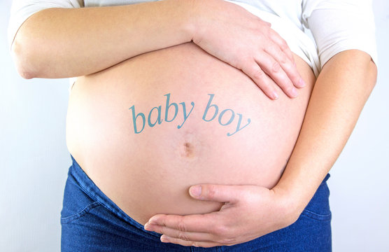 Pregnant woman belly with "baby boy" text