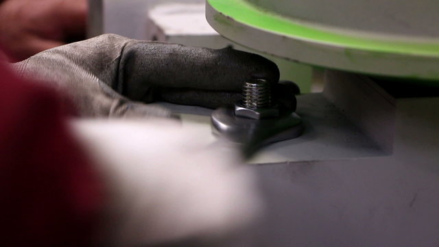 Man tightening a bolt or screw using a socket